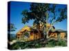 Panoramic View of a Log Cabin on a Hill-null-Stretched Canvas