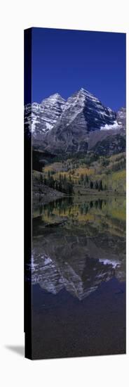 Panoramic View of Autumn Colors of Aspens Reflecting in Lake under Maroon Bells-null-Stretched Canvas
