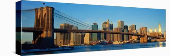 Panoramic View of Brooklyn Bridge and East River at Sunrise with New York City-null-Stretched Canvas