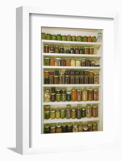 Pantry of preserved fruits and vegetables in canning jars. (PR)-Janet Horton-Framed Photographic Print