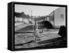 Paper Boy Delivering Newspapers in His Neighborhood-Ed Clark-Framed Stretched Canvas