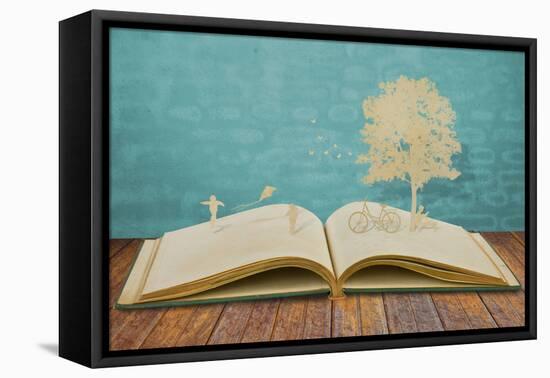 Paper Cut of Children Play on Old Book-jannoon028-Framed Stretched Canvas