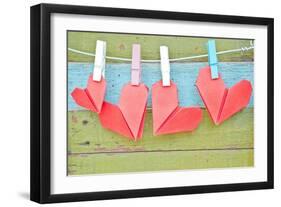 Paper Heart Hanging On The Clothesline. On Old Wood Background-tomgigabite-Framed Art Print