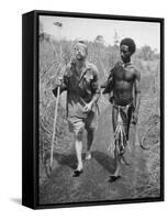 Papuan Native Helping a Wounded Australian Infantryman Along Road Away from the Buna Battlefront-George Silk-Framed Stretched Canvas