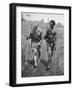 Papuan Native Helping a Wounded Australian Infantryman Along Road Away from the Buna Battlefront-George Silk-Framed Photographic Print