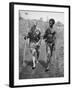 Papuan Native Helping a Wounded Australian Infantryman Along Road Away from the Buna Battlefront-George Silk-Framed Photographic Print