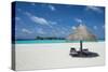 Parasol on a white sand beach and turquoise water, Sun Island Resort, Nalaguraidhoo island, Ari ato-Michael Runkel-Stretched Canvas