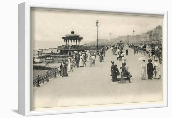 Parasols are Carried by Many Holidaymakers on the Promenade at Brighton-null-Framed Photographic Print