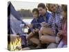 Parents And Their Children Sitting Around a Campfire Toasting Marshmallows-null-Stretched Canvas