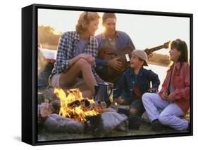 Parents And Their Children Sitting Around a Campfire-null-Framed Stretched Canvas