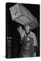 Paris Porter Wearing a Special Hard-Crowned Hat to Carry a Fish Crate, 1946-null-Stretched Canvas
