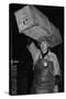 Paris Porter Wearing a Special Hard-Crowned Hat to Carry a Fish Crate, 1946-null-Stretched Canvas