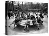 Parisian Children Riding Merry Go Round in a Playground-Alfred Eisenstaedt-Stretched Canvas