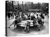 Parisian Children Riding Merry Go Round in a Playground-Alfred Eisenstaedt-Stretched Canvas