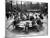 Parisian Children Riding Merry Go Round in a Playground-Alfred Eisenstaedt-Mounted Photographic Print