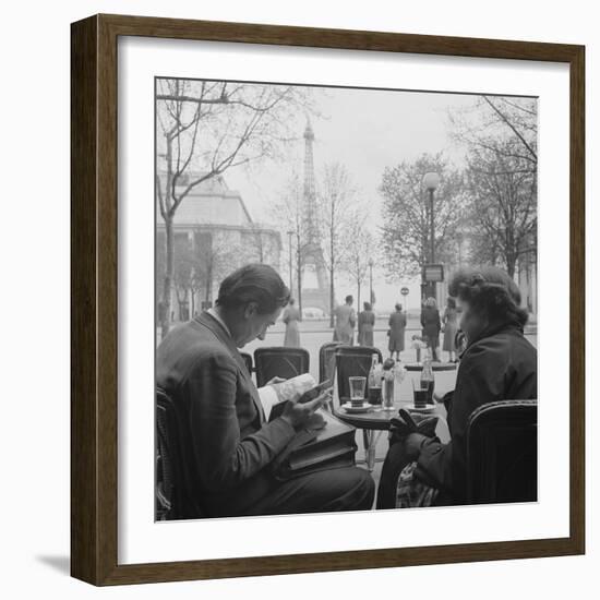 Parisian Couple Drinking Coca Cola at a Sidewalk Cafe While Reading, Paris, France, 1950-Mark Kauffman-Framed Photographic Print