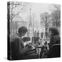 Parisian Couple Drinking Coca Cola at a Sidewalk Cafe While Reading, Paris, France, 1950-Mark Kauffman-Stretched Canvas