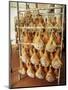 Parma Hams on Curing Racks, Near Pavullo, Emilia-Romagna, Italy-Ian Griffiths-Mounted Photographic Print