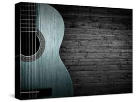 Part of a Blue Acoustic Guitar on a Gray Wooden Background-Boiko Y-Stretched Canvas