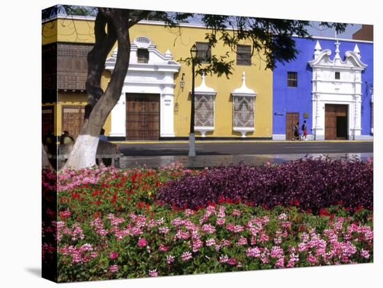 Pastel Shades and Wrought Iron Grillwork Dominate Colonial Architecture in Centre of Trujillo, Peru-Andrew Watson-Stretched Canvas