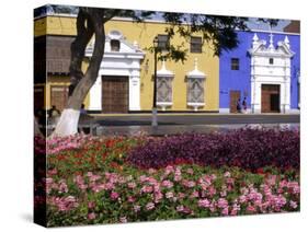 Pastel Shades and Wrought Iron Grillwork Dominate Colonial Architecture in Centre of Trujillo, Peru-Andrew Watson-Stretched Canvas