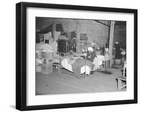 Patient in a Red Cross temporary infirmary for flood refugees at Forrest City, Arkansas, 1937-Walker Evans-Framed Photographic Print