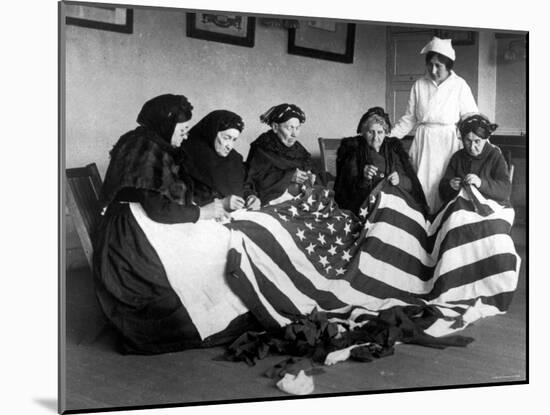 Patriotic Old Female Immigrants Sewing an American Flag under Supervision of Instructor Rose Radin-null-Mounted Photographic Print