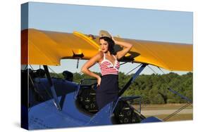 Patriotic Pin-Up Girl Standing Inside the Cockpit of a Stearman Biplane-null-Stretched Canvas
