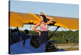 Patriotic Pin-Up Girl Standing Inside the Cockpit of a Stearman Biplane-null-Stretched Canvas