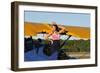 Patriotic Pin-Up Girl Standing Inside the Cockpit of a Stearman Biplane-null-Framed Photographic Print