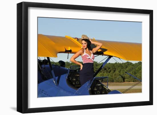 Patriotic Pin-Up Girl Standing Inside the Cockpit of a Stearman Biplane-null-Framed Photographic Print