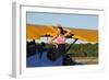 Patriotic Pin-Up Girl Standing Inside the Cockpit of a Stearman Biplane-null-Framed Photographic Print