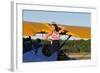 Patriotic Pin-Up Girl Standing Inside the Cockpit of a Stearman Biplane-null-Framed Photographic Print