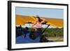 Patriotic Pin-Up Girl Standing Inside the Cockpit of a Stearman Biplane-null-Framed Photographic Print