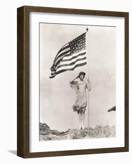 Patriotic Woman Holding American Flag and Saluting-null-Framed Photo