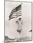 Patriotic Woman Holding American Flag and Saluting-null-Mounted Photo