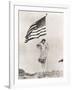 Patriotic Woman Holding American Flag and Saluting-null-Framed Photo