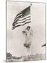 Patriotic Woman Holding American Flag and Saluting-null-Mounted Photo