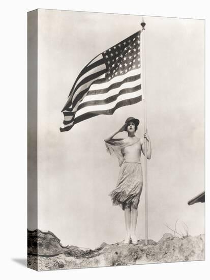 Patriotic Woman Holding American Flag and Saluting-null-Stretched Canvas