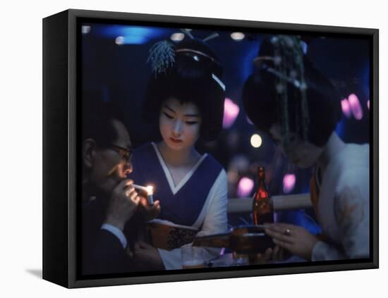 Patron of Nightclub Uruwashi Having His Cigarette Lit by Geisha-Eliot Elisofon-Framed Stretched Canvas