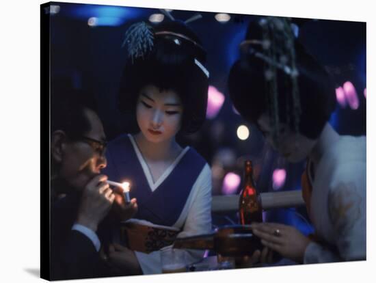 Patron of Nightclub Uruwashi Having His Cigarette Lit by Geisha-Eliot Elisofon-Stretched Canvas