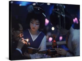 Patron of Nightclub Uruwashi Having His Cigarette Lit by Geisha-Eliot Elisofon-Stretched Canvas