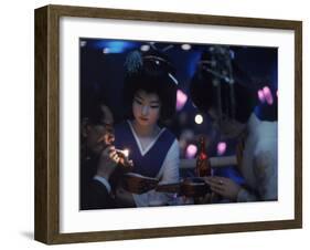 Patron of Nightclub Uruwashi Having His Cigarette Lit by Geisha-Eliot Elisofon-Framed Photographic Print