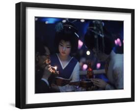 Patron of Nightclub Uruwashi Having His Cigarette Lit by Geisha-Eliot Elisofon-Framed Photographic Print