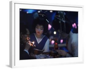 Patron of Nightclub Uruwashi Having His Cigarette Lit by Geisha-Eliot Elisofon-Framed Photographic Print