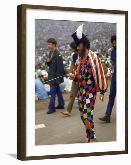 Paul Foster Walking During the Woodstock Music and Art Festival-Bill Eppridge-Framed Premium Photographic Print