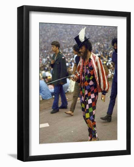 Paul Foster Walking During the Woodstock Music and Art Festival-Bill Eppridge-Framed Photographic Print