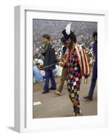 Paul Foster Walking During the Woodstock Music and Art Festival-Bill Eppridge-Framed Photographic Print