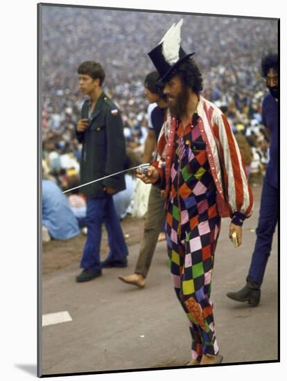 Paul Foster Walking During the Woodstock Music and Art Festival-Bill Eppridge-Mounted Photographic Print