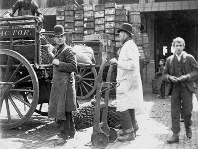 Unloading at Billingsgate Market, London, 1893